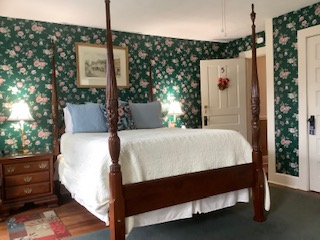 Sandi's room is a large stately room with a queen pencil post bed, a full-size convertible sofa and two wing back chairs with a private shower room. Sandi's room has hardwood floors and is one of the larger rooms at the front of the house with some mountain views.